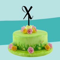 Cake-Topper schwarz X auf Torte